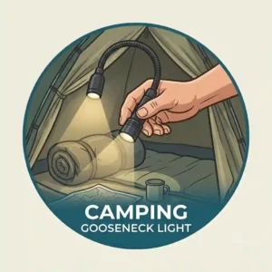 A small rechargeable clip on flashlight fastened to a backpack strap inside a camping tent.